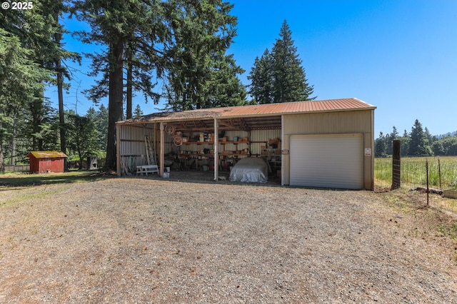 15170 SE 202nd Ave, Damascus, OR 97089 - garage featuring a garage and gravel driveway