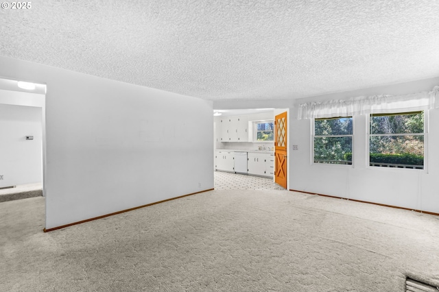 15170 SE 202nd Ave, Damascus, OR 97089 - carpeted spare room featuring a textured ceiling and baseboards