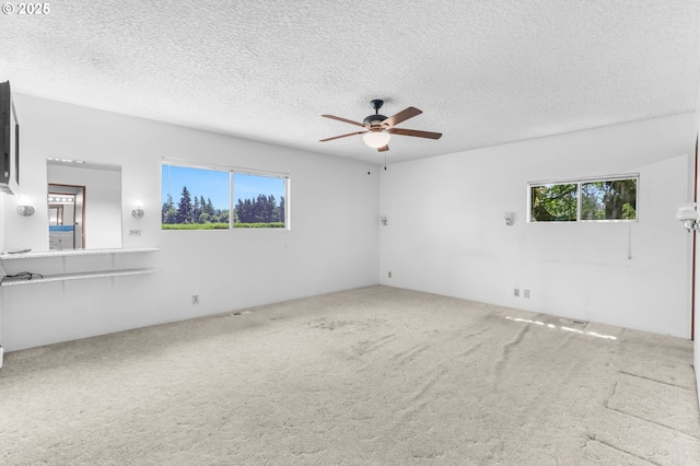 15170 SE 202nd Ave, Damascus, OR 97089 - carpeted spare room featuring plenty of natural light, ceiling fan, and a textured ceiling