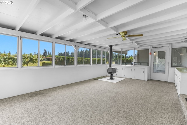 15170 SE 202nd Ave, Damascus, OR 97089 - unfurnished sunroom featuring a wood stove, ceiling fan, and carpet floors