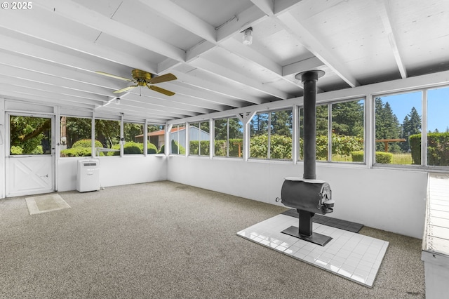 15170 SE 202nd Ave, Damascus, OR 97089 - unfurnished sunroom featuring a wood stove, ceiling fan, and beam ceiling