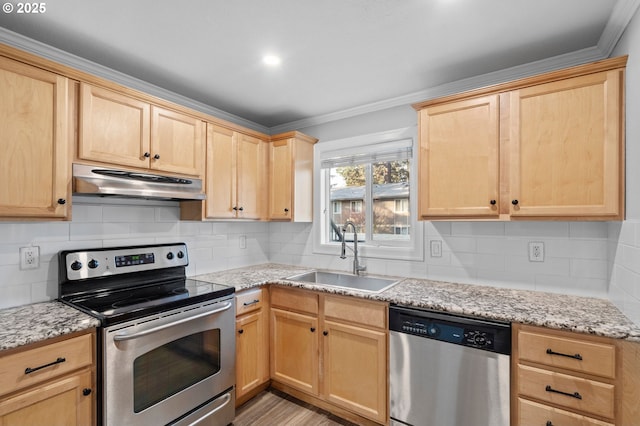 kitchen with appliances with stainless steel finishes, light brown cabinetry, sink, decorative backsplash, and light stone countertops