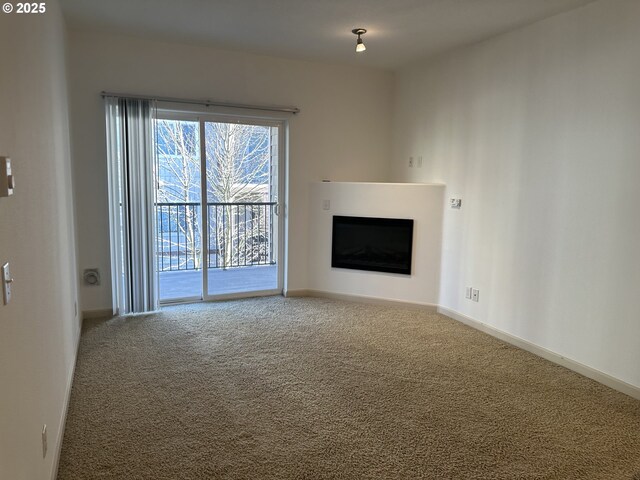 unfurnished living room with carpet flooring