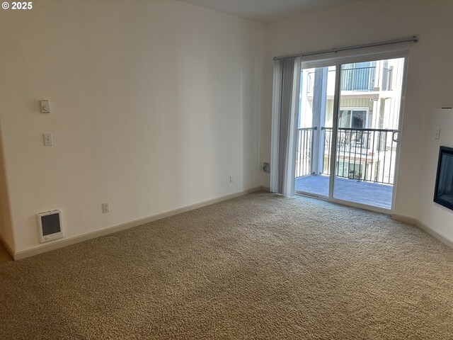 spare room with carpet flooring