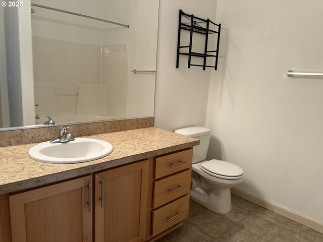 bathroom featuring toilet and vanity