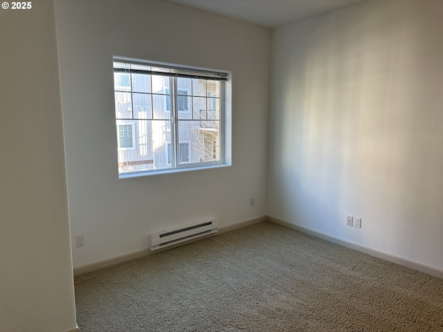 carpeted spare room with baseboard heating