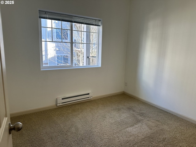 unfurnished room featuring baseboard heating and carpet flooring