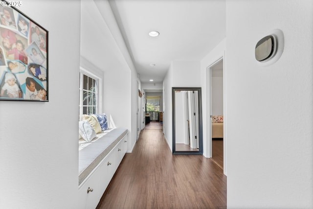 hallway featuring dark wood-type flooring