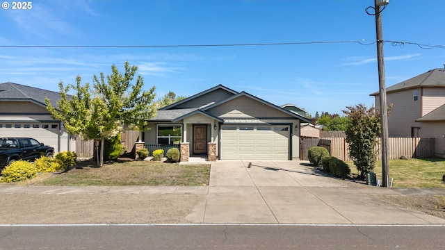 view of front of property featuring a garage, concrete driveway, and covered porch