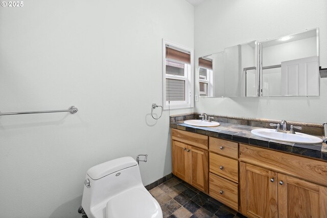 bathroom with toilet and vanity