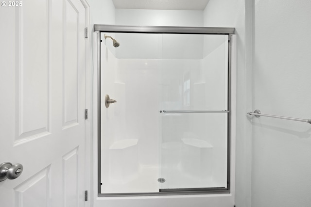 bathroom with an enclosed shower