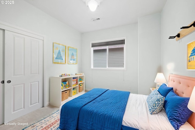 carpeted bedroom with a closet