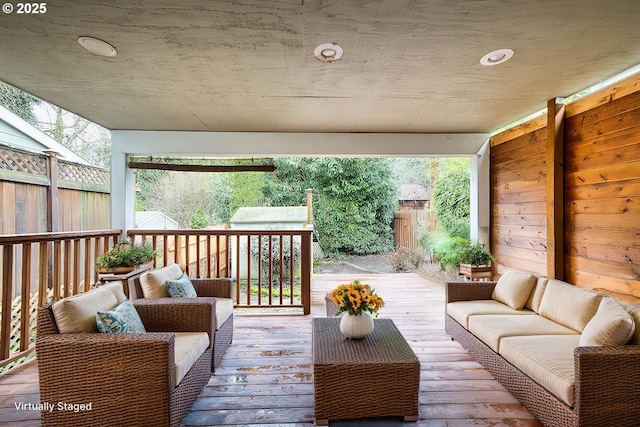 wooden deck featuring an outdoor living space