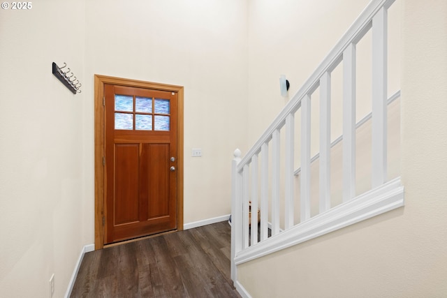 foyer with dark hardwood / wood-style floors