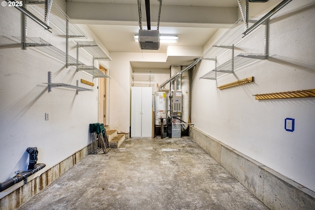 garage featuring water heater and a garage door opener