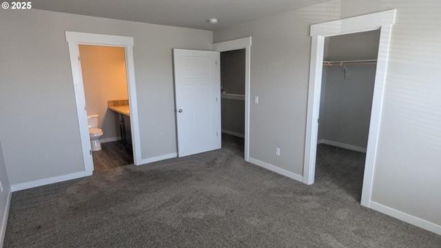 1745 NE 8th St, Hermiston, OR 97838 - unfurnished bedroom with baseboards, carpet, a closet, and a spacious closet