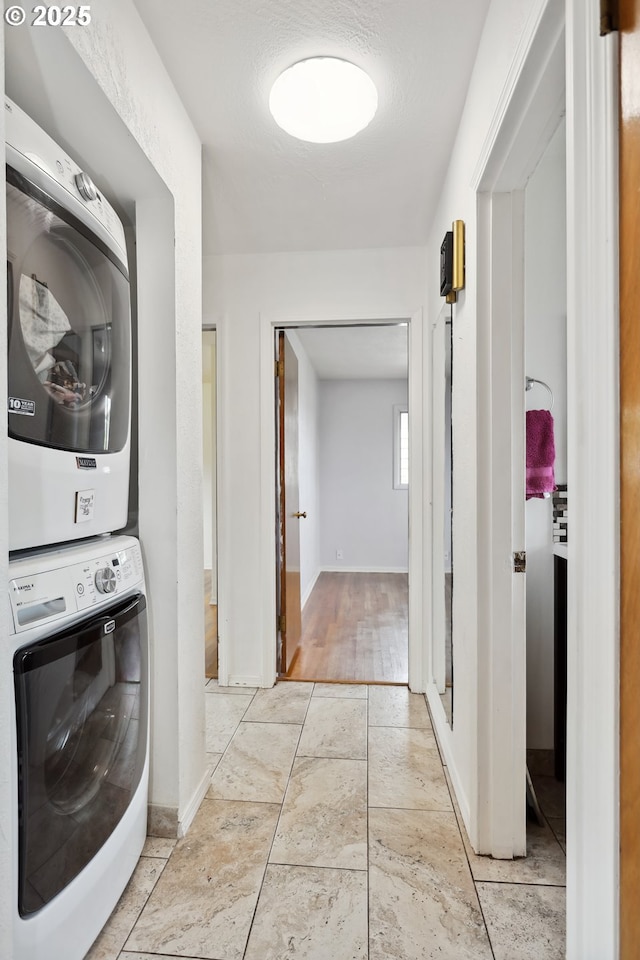 1831 E 14th St, The Dalles, OR 97058 - washroom featuring stacked washer / dryer and baseboards