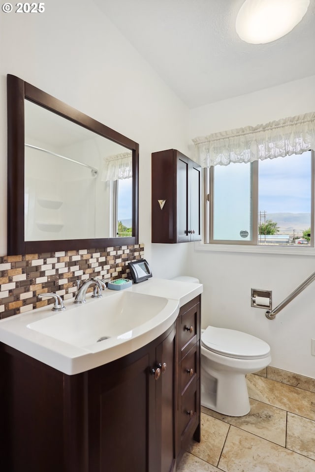 1831 E 14th St, The Dalles, OR 97058 - full bathroom with vanity, toilet, tasteful backsplash, and a shower