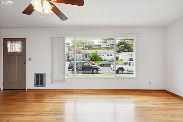 1831 E 14th St, The Dalles, OR 97058 - foyer entrance featuring ceiling fan, wood finished floors, baseboards, and heating unit