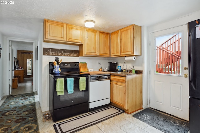 1831 E 14th St, The Dalles, OR 97058 - kitchen featuring black appliances, a sink, light brown cabinetry, and light tile patterned flooring