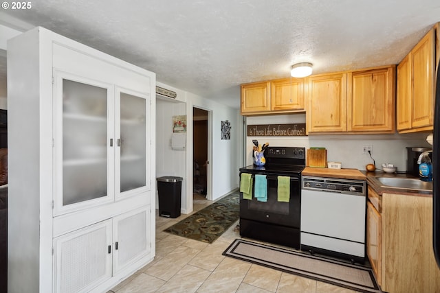 1831 E 14th St, The Dalles, OR 97058 - kitchen with black electric range, white dishwasher, and a sink