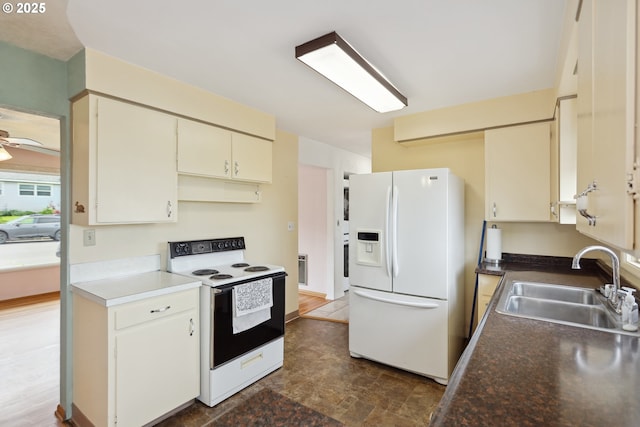1831 E 14th St, The Dalles, OR 97058 - kitchen with white appliances, a sink, a ceiling fan, and dark stone finish floors