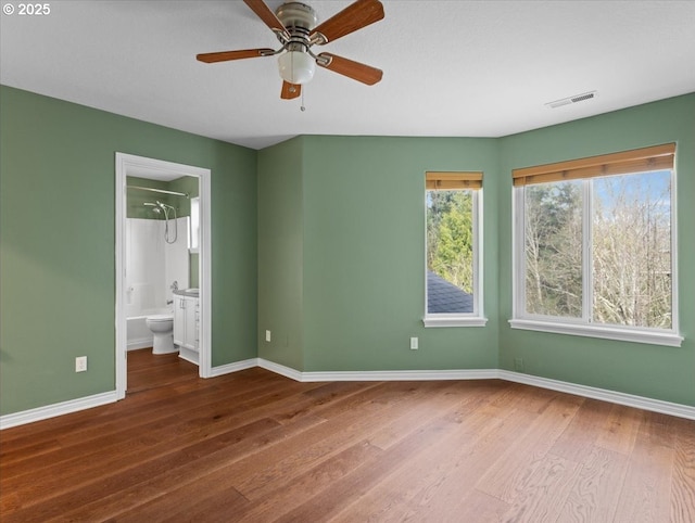 17575 SW Heatherwood Ln, Sherwood, OR 97140 - unfurnished bedroom featuring visible vents, baseboards, ensuite bathroom, and wood finished floors