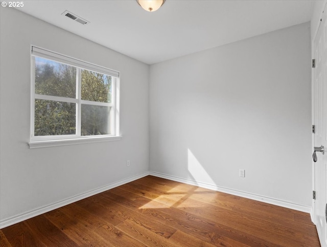 17575 SW Heatherwood Ln, Sherwood, OR 97140 - unfurnished room featuring wood finished floors, baseboards, and visible vents
