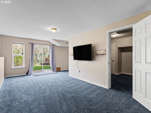 17575 SW Heatherwood Ln, Sherwood, OR 97140 - unfurnished living room with carpet, a textured ceiling, and baseboards