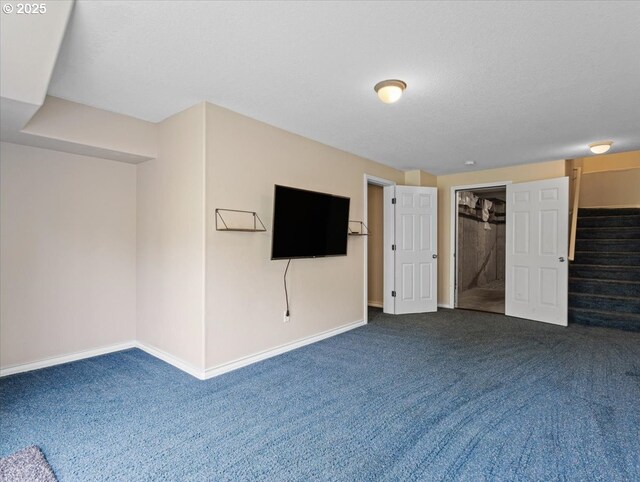17575 SW Heatherwood Ln, Sherwood, OR 97140 - unfurnished living room featuring dark colored carpet, baseboards, and stairway