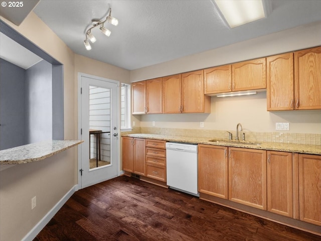 17575 SW Heatherwood Ln, Sherwood, OR 97140 - kitchen with dark wood-type flooring, dishwasher, a sink, and light stone countertops