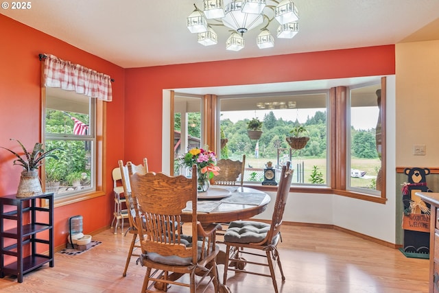 241 Growlers Gulch Rd, Castle Rock, WA 98611 - dining area with light wood-style flooring, plenty of natural light, and a chandelier