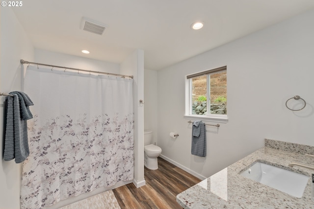 119/121 Tioga Ln, Idleyld Park, OR 97447 - full bathroom with toilet, wood finished floors, vanity, baseboards, and a shower with curtain