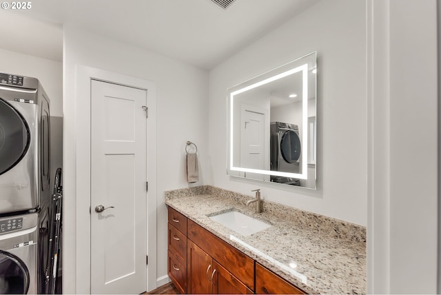 119/121 Tioga Ln, Idleyld Park, OR 97447 - laundry room with stacked washer and clothes dryer