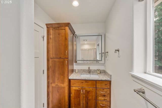 bathroom featuring vanity and a wealth of natural light