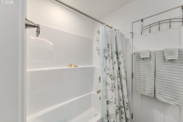 bathroom featuring shower / bath combination with curtain