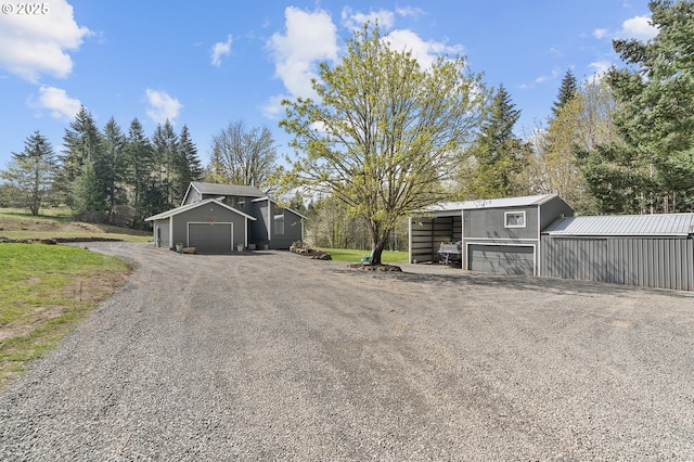 19434 S Logan Dr, Beavercreek, OR 97004 - view of pole building with driveway, a garage, and a carport
