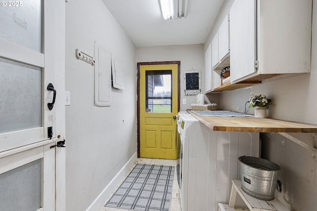 19434 S Logan Dr, Beavercreek, OR 97004 - washroom with cabinet space, separate washer and dryer, light tile patterned floors, and electric panel