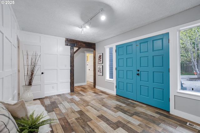 19434 S Logan Dr, Beavercreek, OR 97004 - entryway with wood finished floors and a textured ceiling