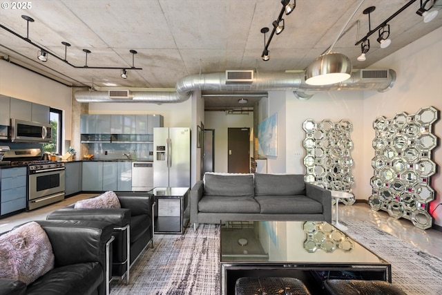 1030 NW 12th Ave Unit 201, Portland, OR 97209 - living room featuring rail lighting