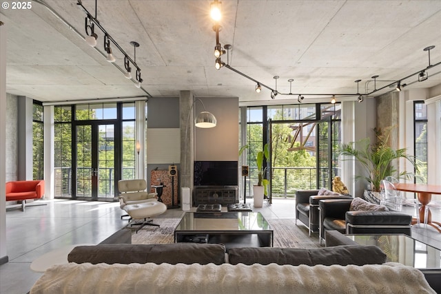 1030 NW 12th Ave Unit 201, Portland, OR 97209 - living room featuring a wall of windows and plenty of natural light