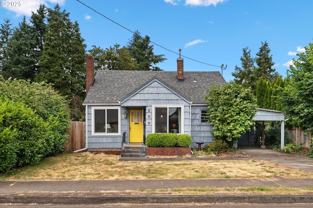 250 17th St, Springfield, OR 97477 - bungalow-style house with a chimney, concrete driveway, a shingled roof, and an attached carport