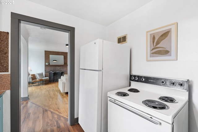 250 17th St, Springfield, OR 97477 - kitchen with white appliances and wood finished floors