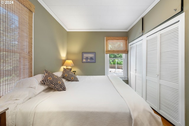bedroom featuring crown molding