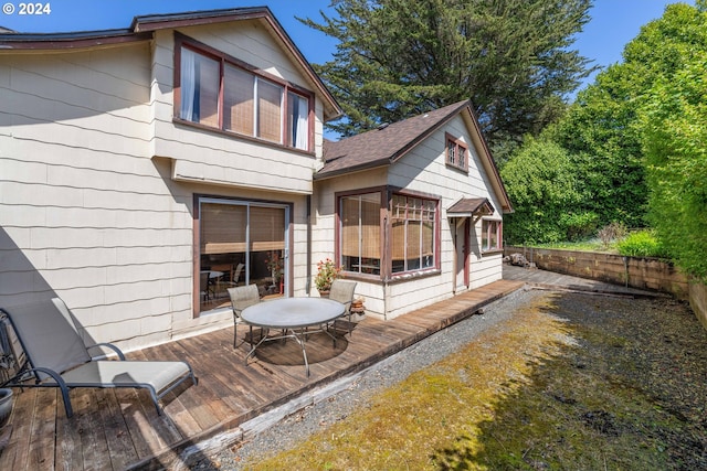 rear view of house with a wooden deck