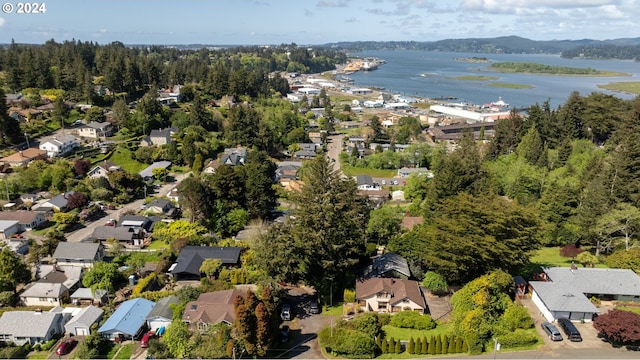 aerial view featuring a residential view and a water view