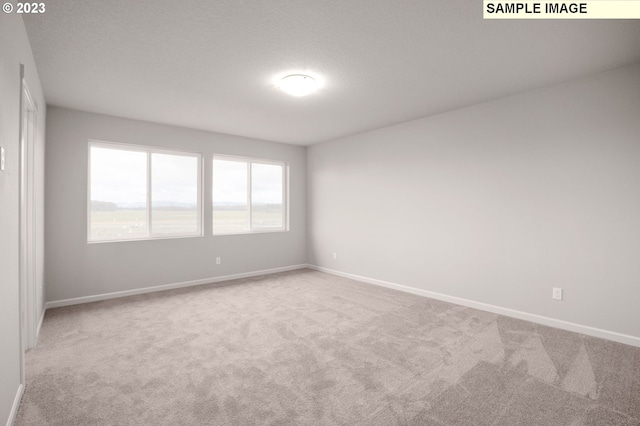 6286 SE 20th St, Gresham, OR 97080 - spare room with carpet floors and baseboards