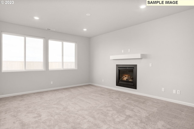 6286 SE 20th St, Gresham, OR 97080 - unfurnished living room with a glass covered fireplace, carpet, baseboards, and recessed lighting