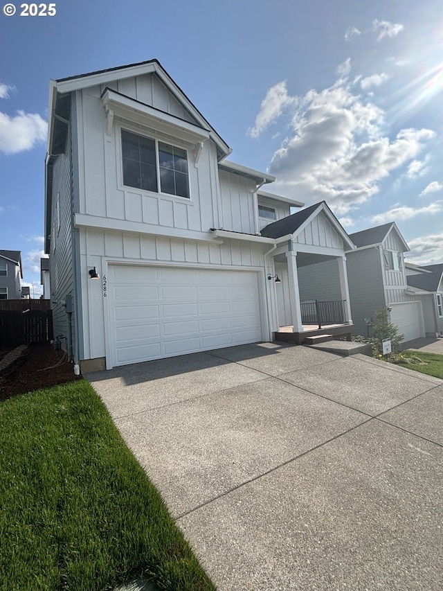 6286 SE 20th St, Gresham, OR 97080 - view of front of home featuring board and batten siding, driveway, and an attached garage