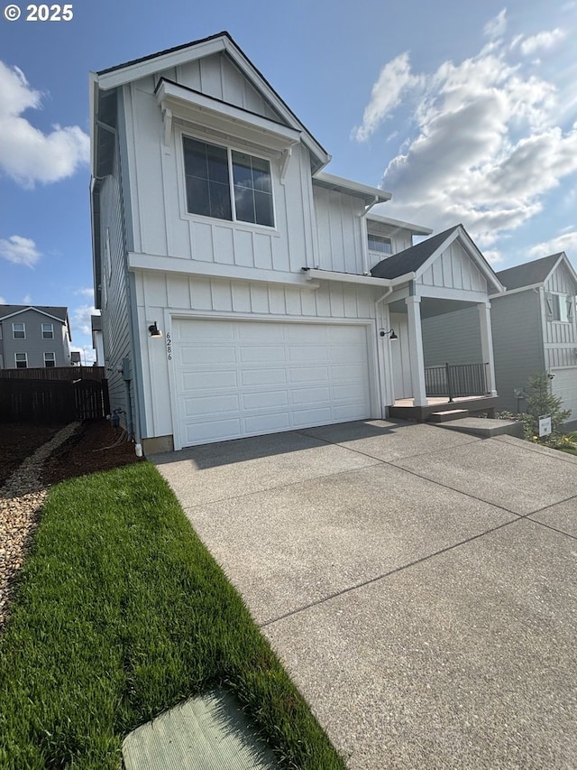 6286 SE 20th St, Gresham, OR 97080 - view of front of property with board and batten siding, concrete driveway, and an attached garage